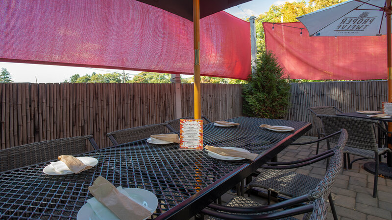 Table set for six in outdoor dining area