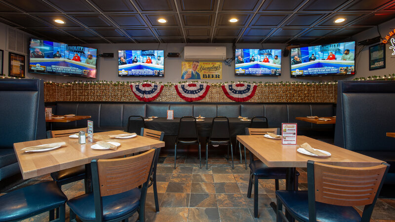 Bar dining area with booth and table seating